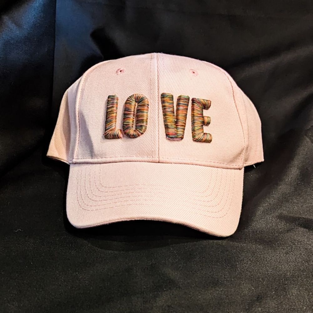 "Rainbow Love: Light Pink Baseball Cap with LGBTQ+ Pride Embroidery"